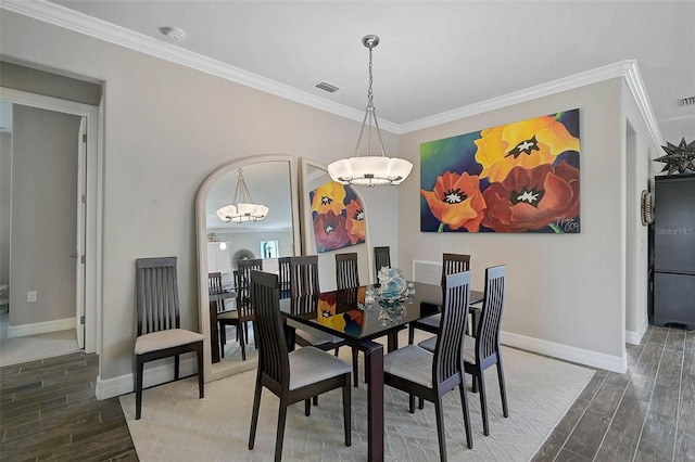 dining room featuring wood tiled floor and crown molding