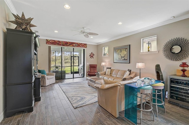 living room with beverage cooler, wood finish floors, recessed lighting, and crown molding