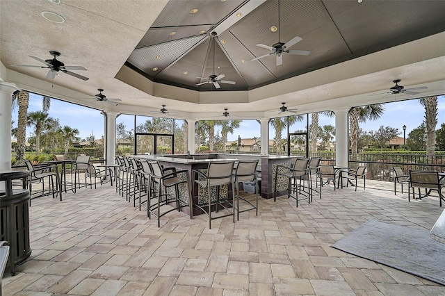 view of patio / terrace featuring ceiling fan and outdoor dry bar