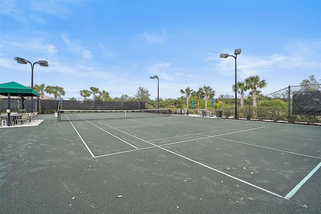 view of sport court with fence