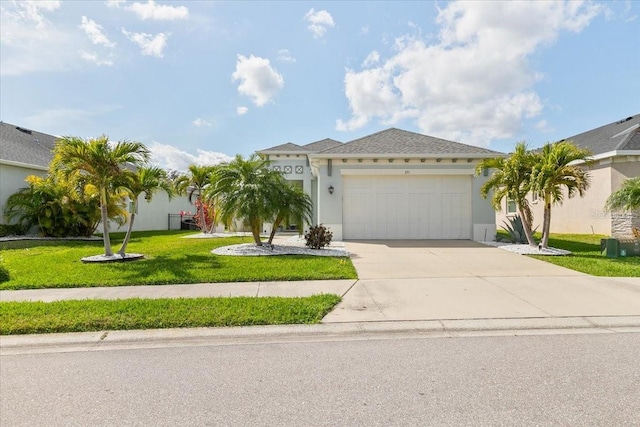 view of front of property with a front lawn, driveway, an attached garage, and stucco siding