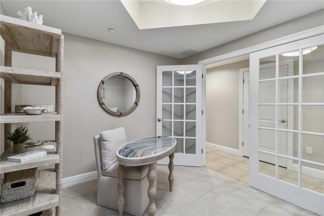 dining area featuring french doors and baseboards