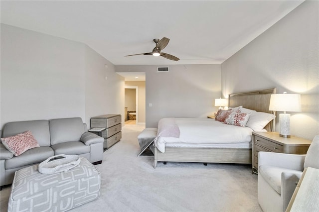 bedroom with visible vents, ceiling fan, and light carpet