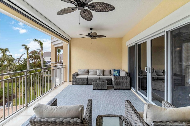 balcony featuring an outdoor hangout area and a ceiling fan