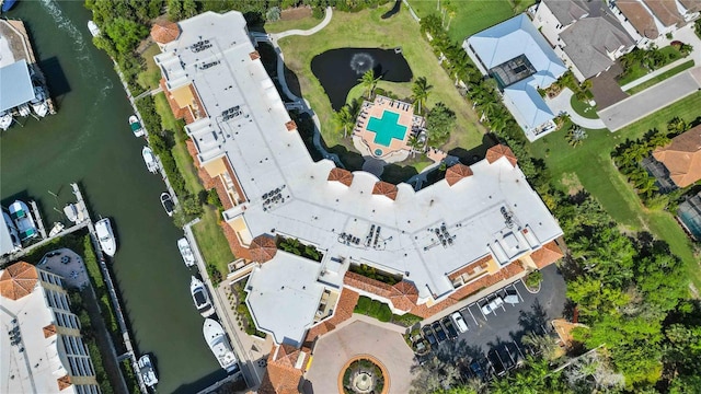 birds eye view of property with a water view and a residential view