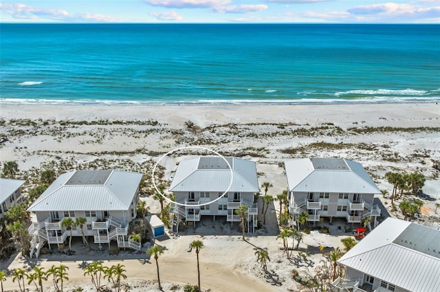 aerial view featuring a water view and a view of the beach