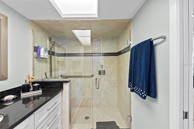 full bath featuring a shower stall and vanity