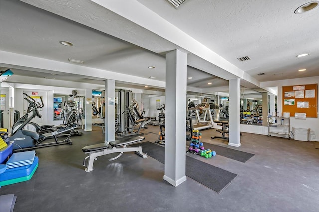 gym with recessed lighting, visible vents, a textured ceiling, and baseboards