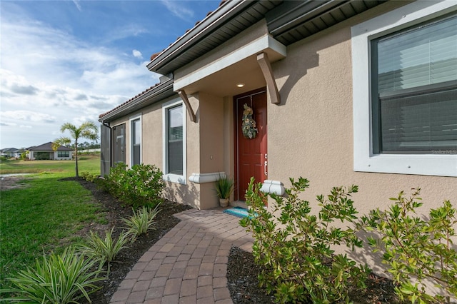 3008 Tolmino Ct, Lakewood Ranch, FL 34211 - entrance to property featuring stucco siding and a lawn