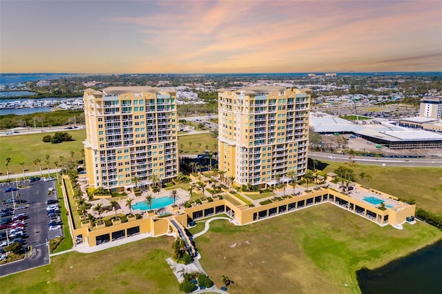 drone / aerial view with a view of city and a water view