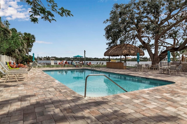 pool featuring a gazebo, a jacuzzi, fence, and a patio