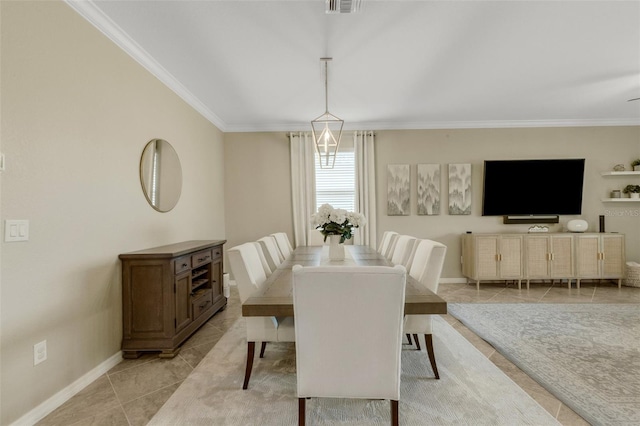 dining room featuring light tile patterned floors, baseboards, visible vents, and ornamental molding