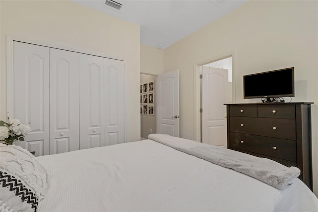 bedroom featuring a closet and visible vents