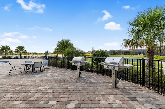 view of patio / terrace with fence and area for grilling