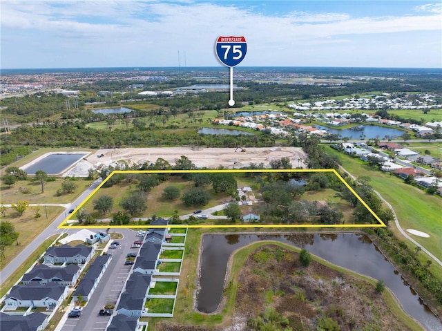 birds eye view of property featuring a residential view and a water view