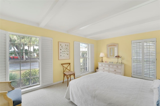 2 Antigua Cir Unit 4, Englewood, FL 34223 - carpeted bedroom with baseboards and beam ceiling