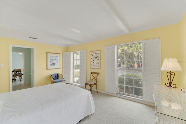 2 Antigua Cir Unit 4, Englewood, FL 34223 - bedroom with visible vents, light carpet, beam ceiling, and baseboards