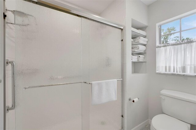 2 Antigua Cir Unit 4, Englewood, FL 34223 - bathroom featuring toilet and a shower stall