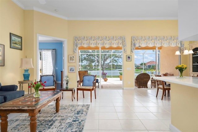 sitting room featuring light tile patterned floors, baseboards, and ornamental molding