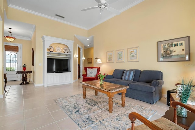 living room with light tile patterned floors, visible vents, baseboards, built in features, and crown molding