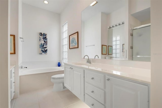 full bathroom with a garden tub, tile patterned flooring, toilet, vanity, and a shower stall