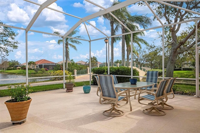 sunroom / solarium with a water view