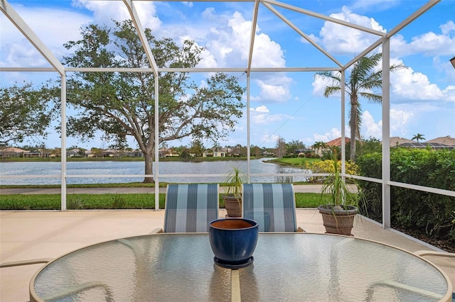 sunroom / solarium with a water view