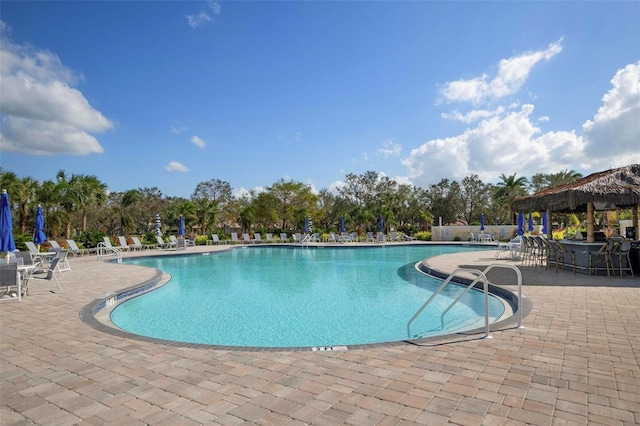 pool featuring a patio and a gazebo