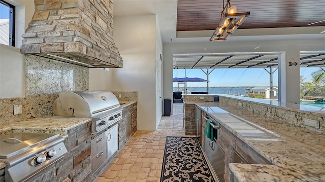 view of patio with an outdoor kitchen, glass enclosure, and grilling area