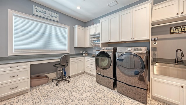 laundry room featuring washing machine and dryer, recessed lighting, a sink, visible vents, and cabinet space