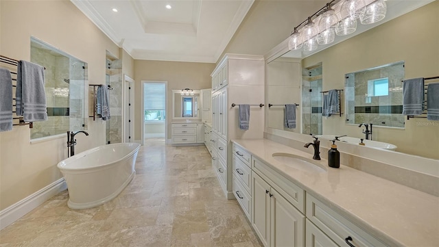 full bath with ornamental molding, tiled shower, vanity, and baseboards