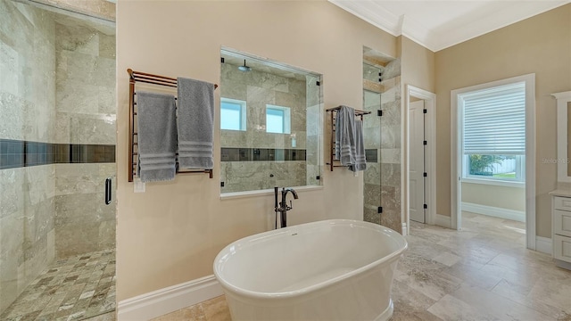 bathroom featuring a stall shower, crown molding, and baseboards