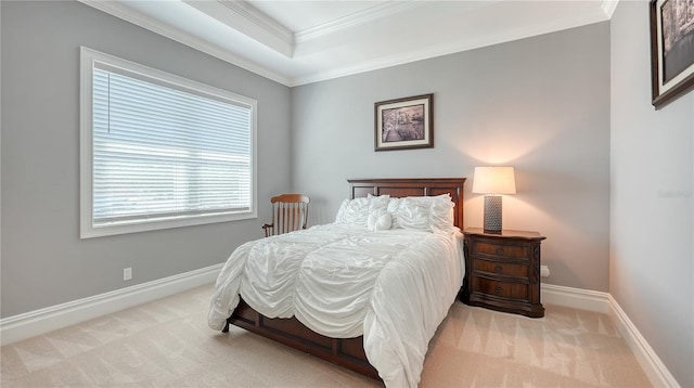 bedroom with ornamental molding, carpet flooring, and baseboards