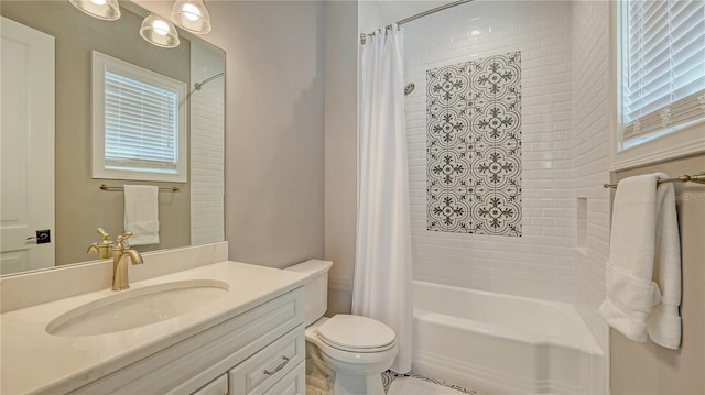 bathroom featuring vanity, toilet, and shower / bathtub combination with curtain