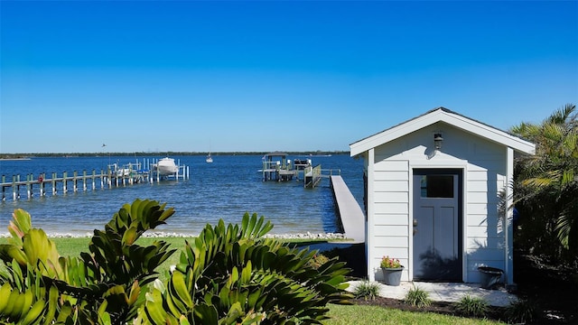 exterior space featuring a boat dock and boat lift