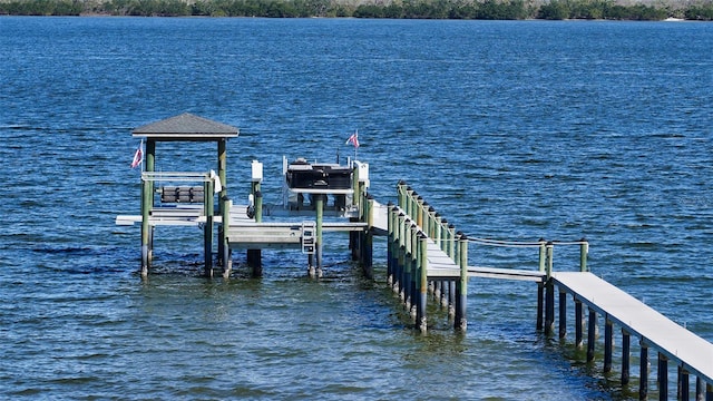 view of dock with a water view and boat lift