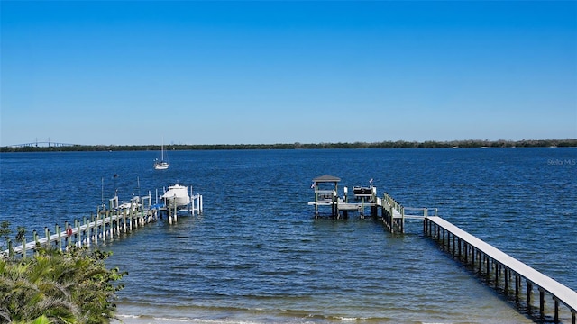 view of dock with a water view and boat lift