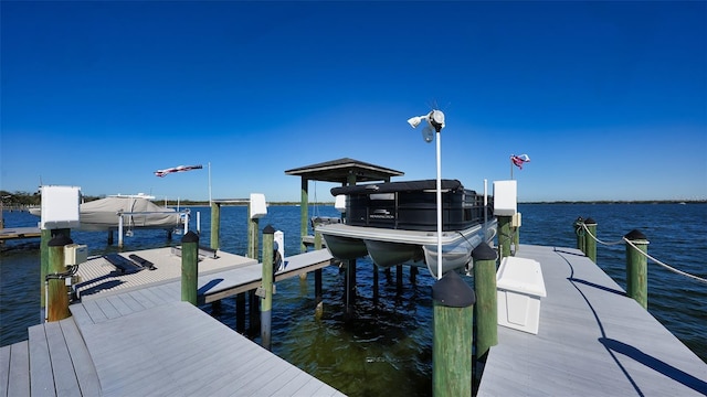 view of dock featuring a water view and boat lift