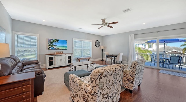 living room featuring recessed lighting, visible vents, ceiling fan, wood finished floors, and baseboards