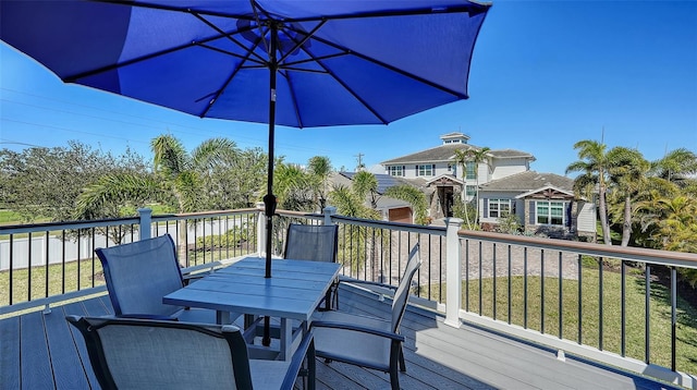 wooden deck featuring outdoor dining space