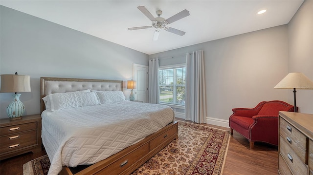 bedroom with a ceiling fan, recessed lighting, baseboards, and wood finished floors