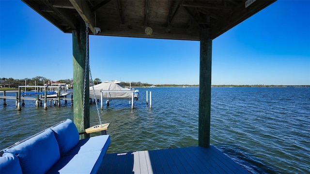 view of dock with a water view and boat lift