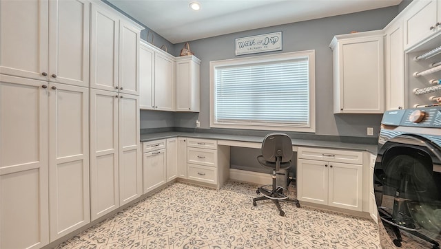 office featuring washer / dryer, built in study area, and baseboards