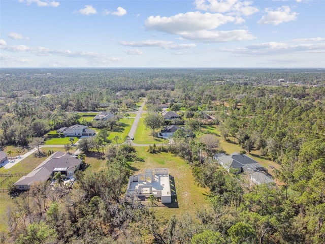 aerial view with a residential view and a view of trees