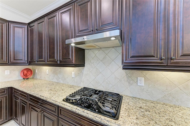 kitchen featuring black gas cooktop, crown molding, light stone countertops, and under cabinet range hood