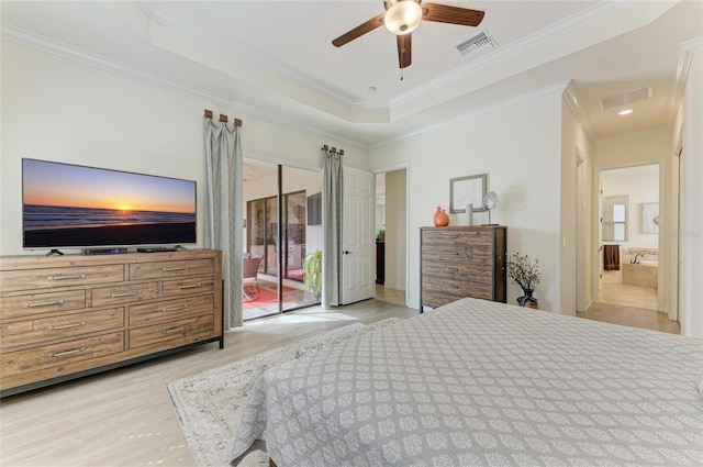 bedroom with visible vents, a raised ceiling, ornamental molding, access to outside, and light wood-style floors