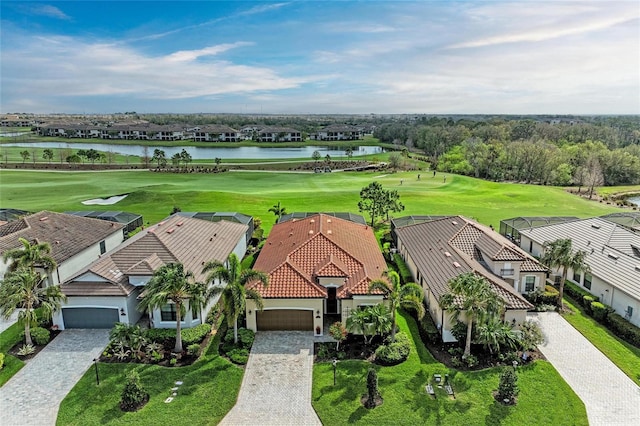 bird's eye view with view of golf course and a water view