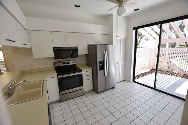 kitchen featuring a sink, a ceiling fan, white cabinets, light countertops, and appliances with stainless steel finishes