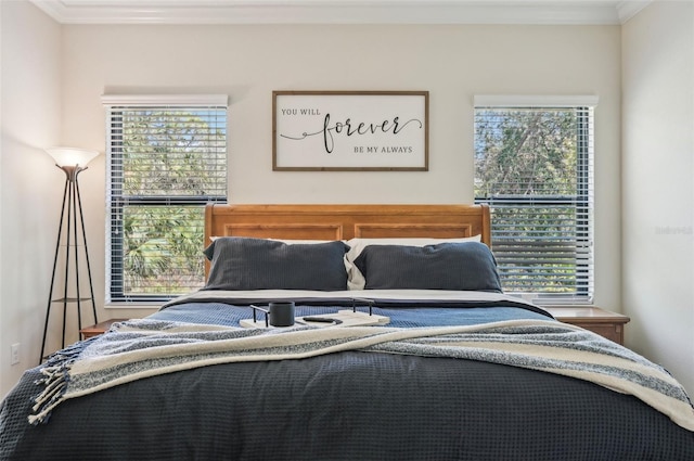 bedroom featuring crown molding