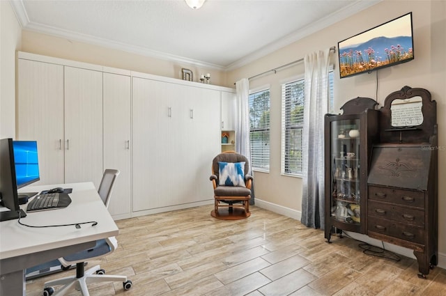 office area with ornamental molding, light wood finished floors, and baseboards